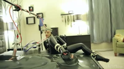 Latex slave punished by a maid
